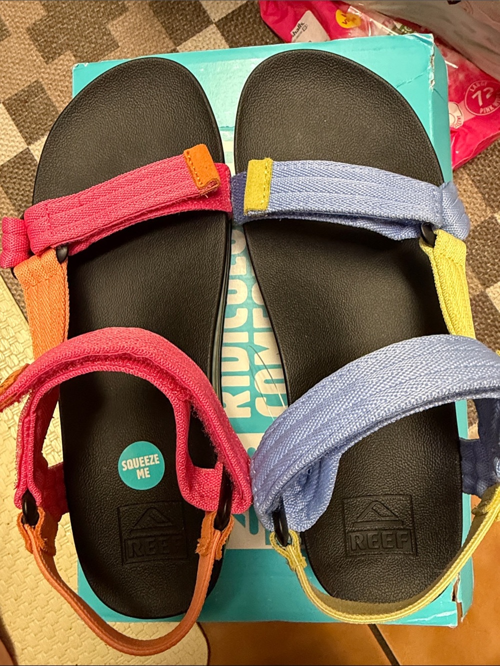 Reef Black Footbed Sandals with Pink, Orange, Blue, and Yellow Straps